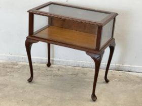 A mahogany and glass display table. 78x47x78cm