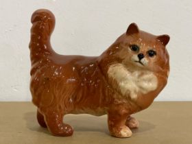 A Beswick pottery cat. 14x12.5cm