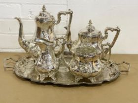 A 4 piece early 20th century Georgian style silver plated tea and coffee service and a tray.