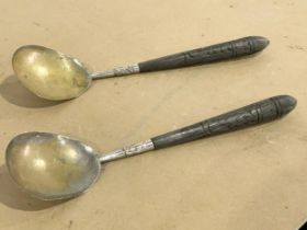 A pair of silver plated service spoons 32.5cm