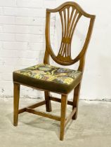 A George III oak Hepplewhite style side chair with tapestry seat. Circa 1800.