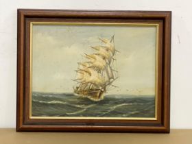 A signed oil painting of a sailing ship. 49.5x39.5cm