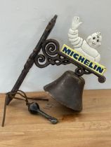 A cast iron Michelin wall hanging bell. 32.5cm
