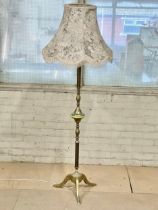 A vintage brass standard lamp. 160cm