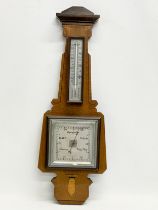 An early 20th century inlaid mahogany barometer. 21x58cm.