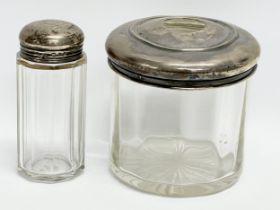 2 silver top vanity bottles. London 1895 and Birmingham 1921. 9x8.5cm