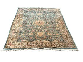 A large vintage Middle Eastern style wool rug. 274x364cm