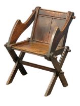 A late Victorian oak ‘Glastonbury’ chair.