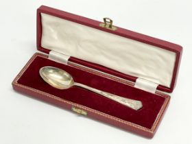 A silver spoon in case. Stamped J.D & S. Sheffield. 57.9 grams.