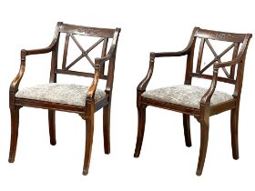 A pair of good quality early 20th century Regency style mahogany armchairs on sabre legs.