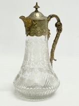A late Victorian etched glass claret jug. 16x26.5cm