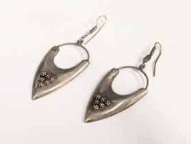 A pair of silver earrings