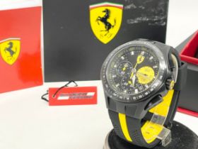 A Scuderia Ferrari watch with box.