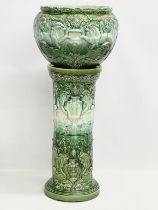 A large late 19th century Majolica jardiniere on stand. Stamped Lily. 42x90cm