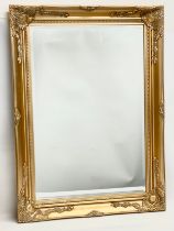 A large gilt framed mirror. 77x107cm