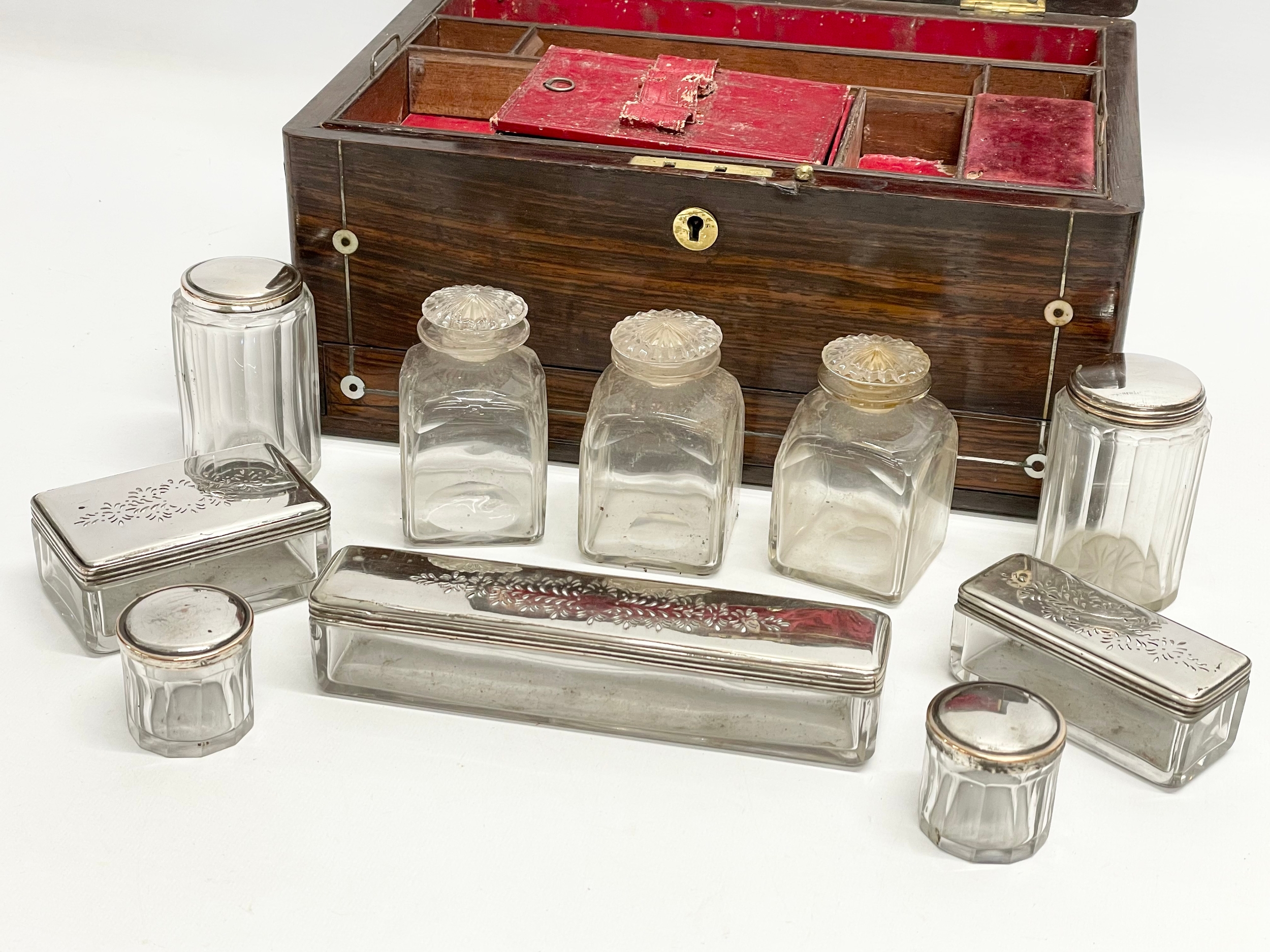 A Victorian rosewood vanity box with Mother of Pearl inlay and cut glass bottles with silver - Image 7 of 11
