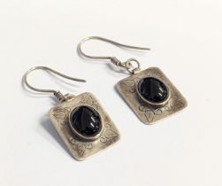 A pair of silver earrings