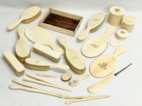 A collection of 19th century bone vanity brushes and mirrors etc.