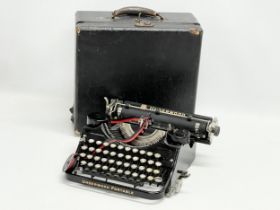 A vintage Underwood Portable typewriter in case.