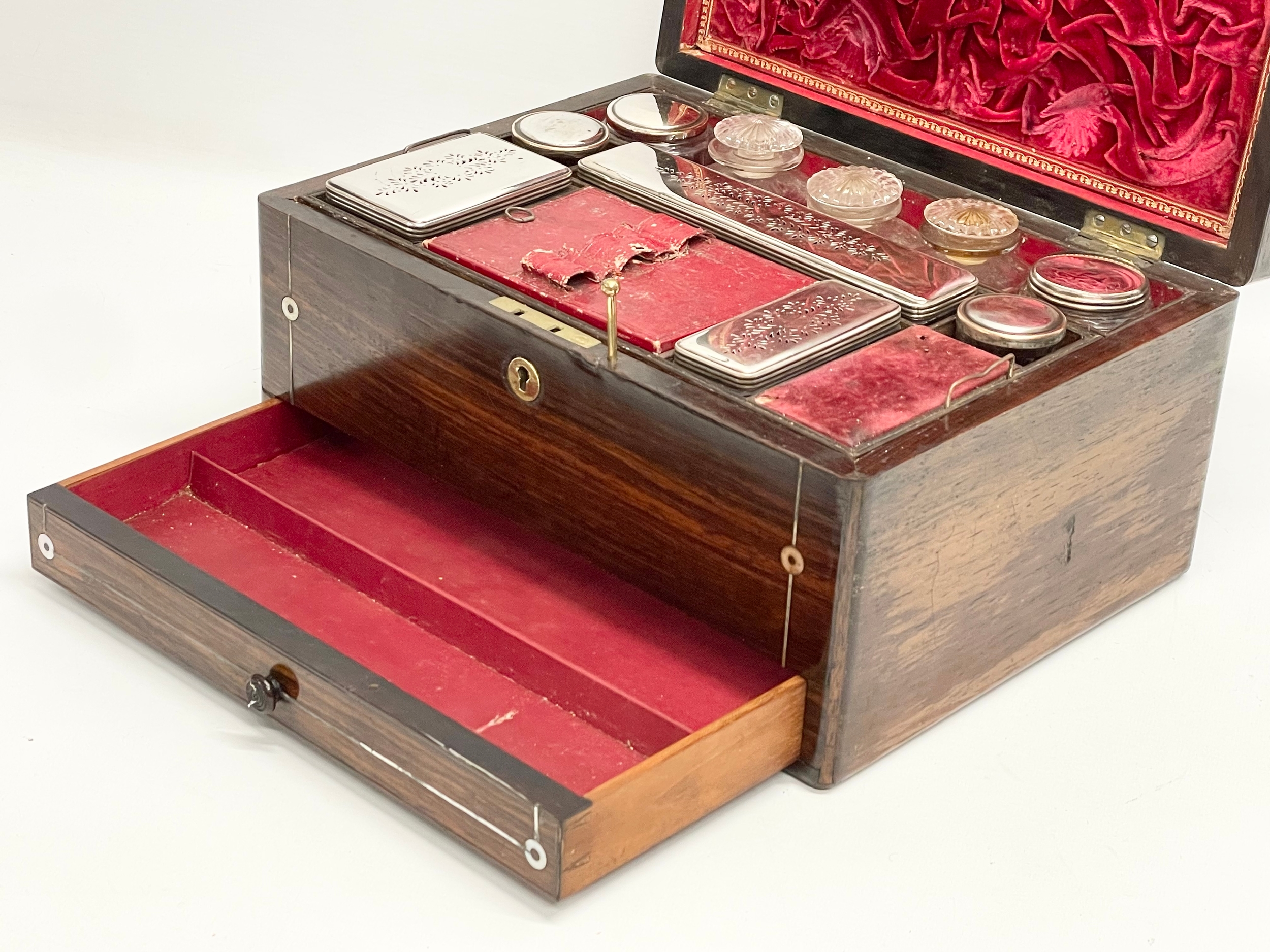 A Victorian rosewood vanity box with Mother of Pearl inlay and cut glass bottles with silver - Image 3 of 11