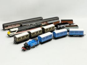 A collection of Hornby trains and carriages. Caledonian Local. Intercity etc.