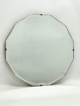 A 1930’s Art Deco bevelled mirror. 41x41cm