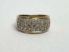 A 9ct gold cluster diamond ring. 5.90 grams. Size N.