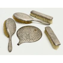 A 5 piece silver vanity set.