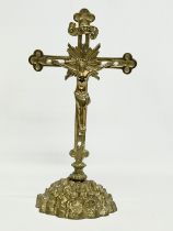 A vintage brass crucifix. 29cm