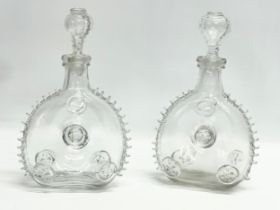 A pair of Remi Martin Baccarat Glass cognac decanters. 16x28cm