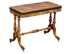 A good quality Victorian Burr Walnut turnover games table with stretcher support on Cabriole legs.