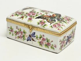 An Atelier Le Tallec, Paris hand painted porcelain trinket box. Limoges France. 14x9x16cm