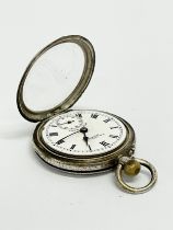 An ornate silver pocket watch. S.D. Neill LTD. Belfast.