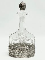 A 19th century silver mounted etched glass decanter. Stamped B.H.M. 925. 24.5cm