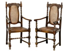 A pair of early 20th century Jacobean style oak barley twist armchairs with bergere backs. Circa
