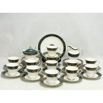 A 39 piece Royal Doulton ‘Carlyle’ tea set. 12 cups, 12 saucers, sugar bowl with lid, milk jug, cake