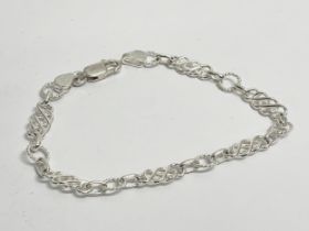 A sterling silver bracket with box. 7.77 grams.