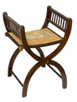 An early 20th century folding x-framed chair. Circa 1900-1920.