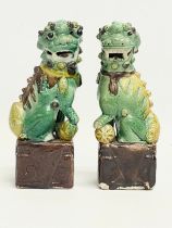 A pair of late 19th Chinese Sancai Glazed porcelain dogs. 16cm.