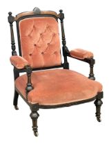 A Victorian Burr Walnut and Ebonised ladies button back armchair.
