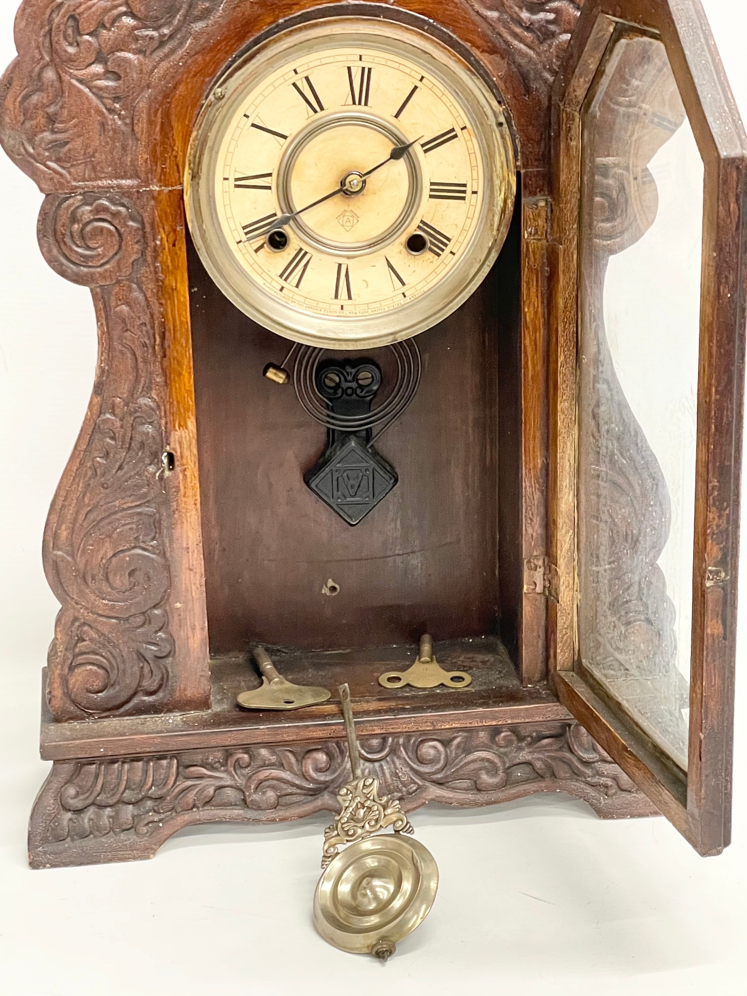 A late 19th century American Gingerbread clock. By Ansonia. With pendulum and 2 keys. 36x12x56.5cm - Image 2 of 3