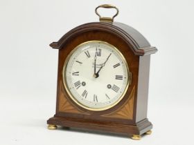 A Comitti of London inlaid mahogany mantle clock. With key. 18x8.5x24cm