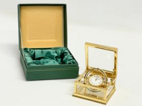 A good quality Sewills ‘Ark Royal’ brass desk clock with box. Clock measures 9x8.5x5cm