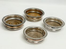 2 pairs of silver plated wine coasters. 15cm