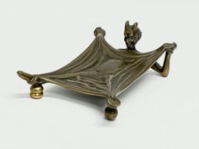 A bronze ‘Devil Under A Sheet’ card tray. By Humphries, Jackson & Ambler LTD. Early 20th century.