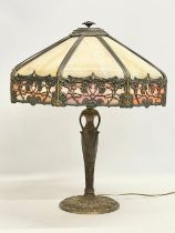 A large good quality vintage brass Tiffany style table lamp. Shade measures 44x44x21cm. Base