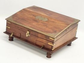 An Indian rosewood brass bound stationary box. 30.5x25x14.5cm