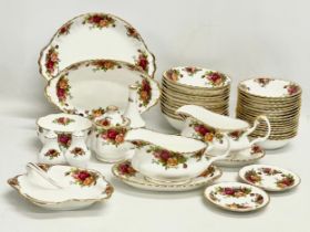 43 pieces of Royal Albert ‘Old Country Roses’ tea and dinner ware. A pair of gravy boats with