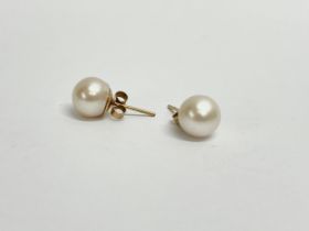 A pair of ladies 9ct gold and pearl earrings.