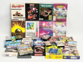 A collection of vintage computer games with boxes and paperwork.